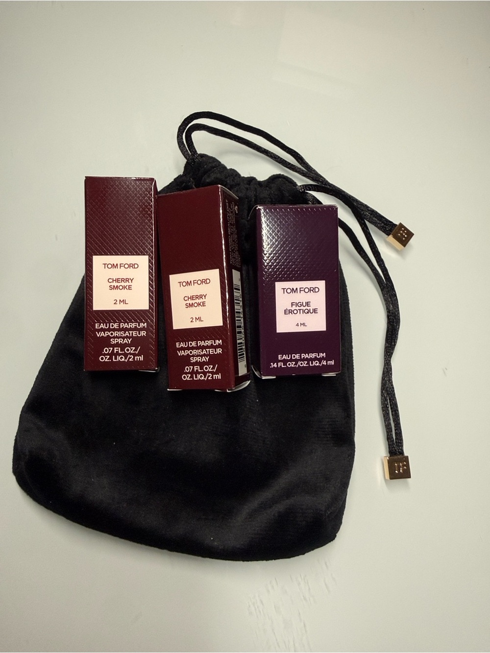 Tom Ford Cherry Smoke and Figue Érotique with black drawstring pouch